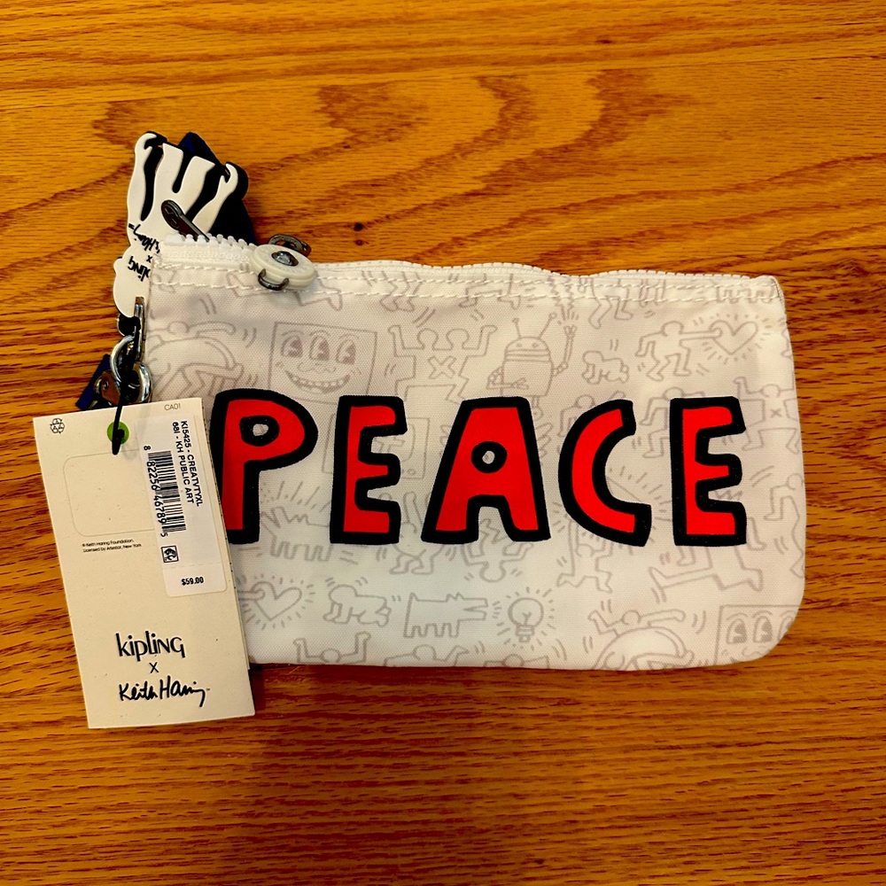 Brand new Kipling, Keith Haring wristlet multiple pockets inside zippers